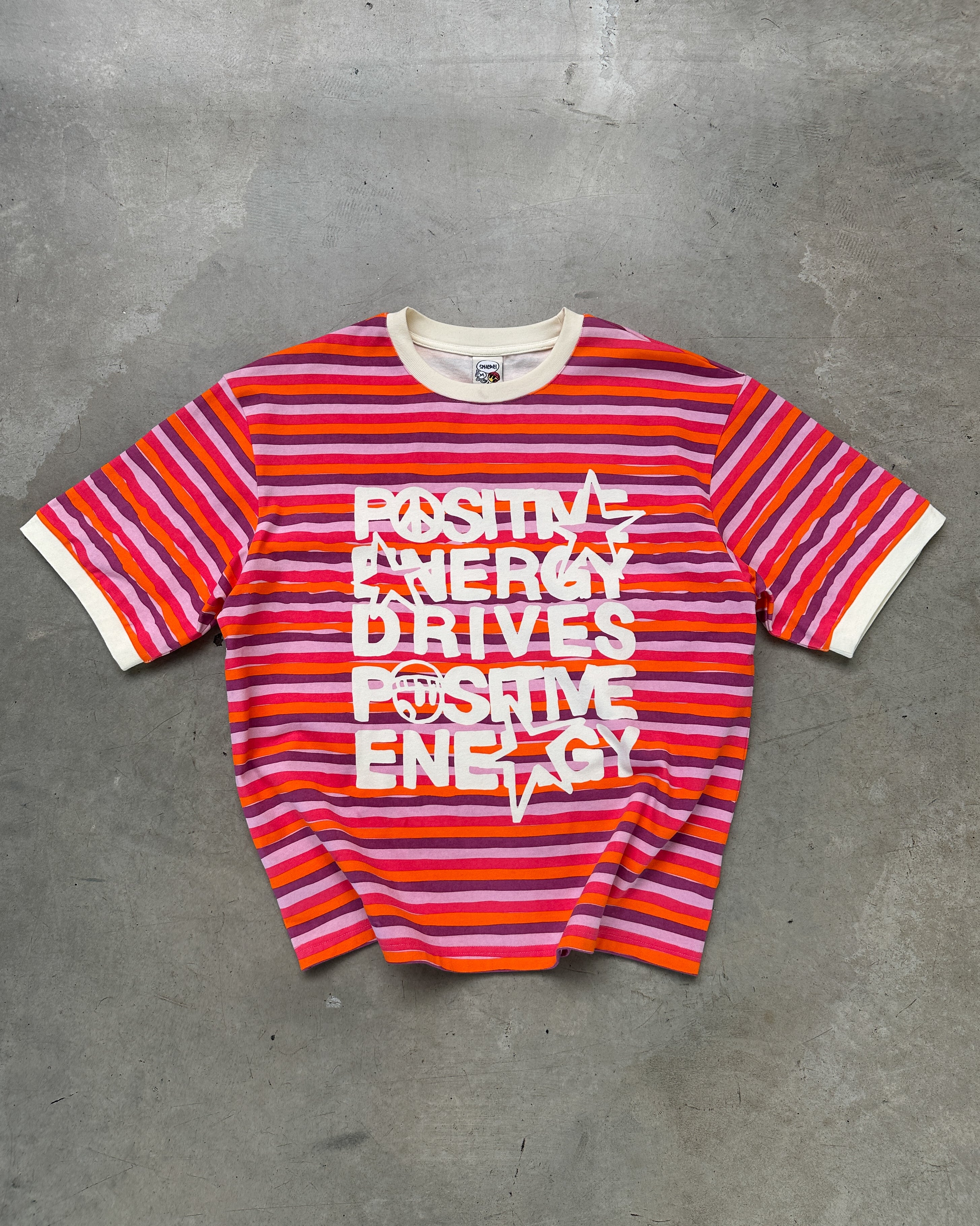 Positive energy stripped tee